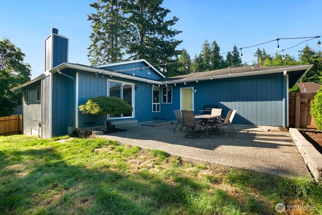13632 SE Fairwood Blvd, Renton, WA 98058 - back of house featuring a chimney and a patio area