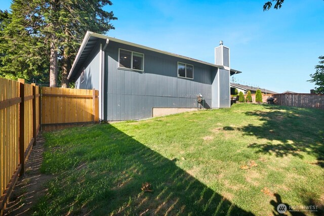 13632 SE Fairwood Blvd, Renton, WA 98058 - rear view of property with a chimney