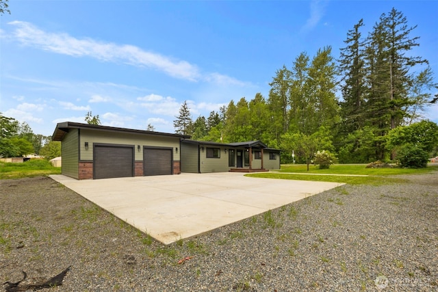 4821 S 364th St, Auburn, WA 98001 - view of front facade with a garage, concrete driveway, and brick siding