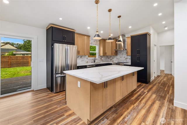 4821 S 364th St, Auburn, WA 98001 - kitchen with appliances with stainless steel finishes, wall chimney exhaust hood, a sink, backsplash, and light stone counters