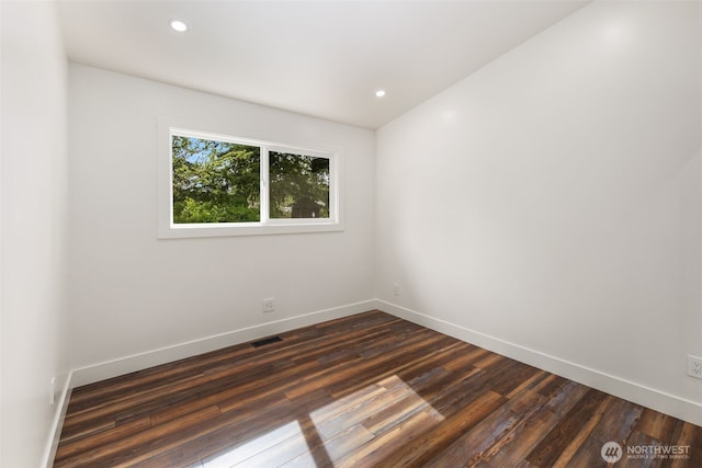 4821 S 364th St, Auburn, WA 98001 - unfurnished room with dark wood-type flooring, baseboards, and recessed lighting