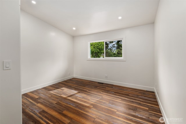 4821 S 364th St, Auburn, WA 98001 - empty room with dark wood-type flooring, baseboards, and recessed lighting