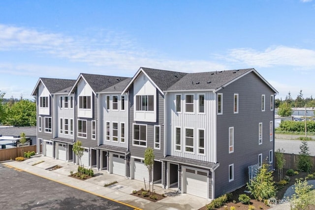 15726 40th Ave W Unit B2, Lynnwood, WA 98087 - view of property featuring a garage, driveway, board and batten siding, and roof with shingles