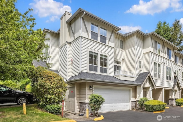 4460 249th Ter SE Unit 4-1, Sammamish, WA 98029 - view of front of house with a garage, asphalt driveway, and a chimney