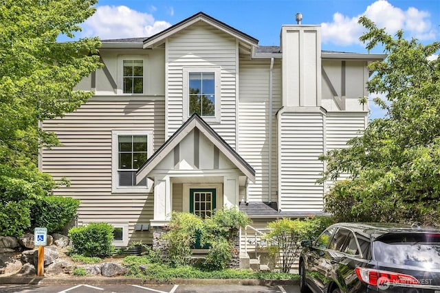 4460 249th Ter SE Unit 4-1, Sammamish, WA 98029 - view of front of home with uncovered parking and a chimney