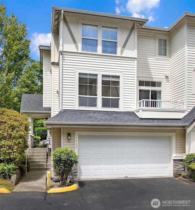 4460 249th Ter SE Unit 4-1, Sammamish, WA 98029 - townhome / multi-family property with an attached garage, asphalt driveway, and stone siding