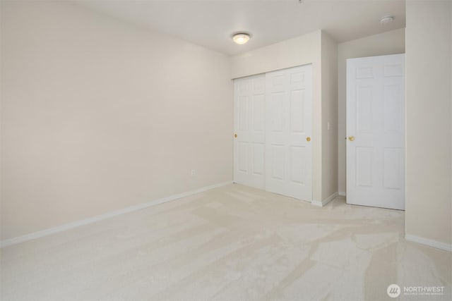 4460 249th Ter SE Unit 4-1, Sammamish, WA 98029 - unfurnished bedroom featuring baseboards, a closet, and carpet floors