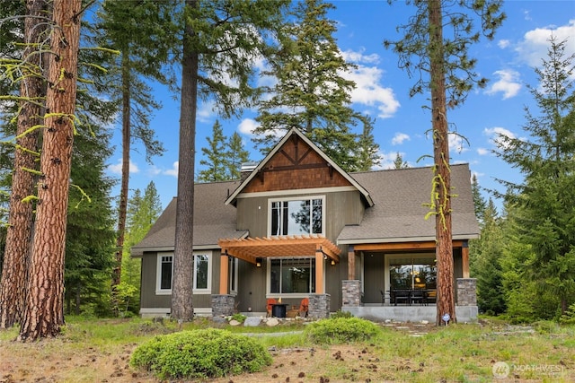 2101 Coal Mine Way, Cle Elum, WA 98922 - rear view of property featuring a shingled roof, stone siding, and a pergola
