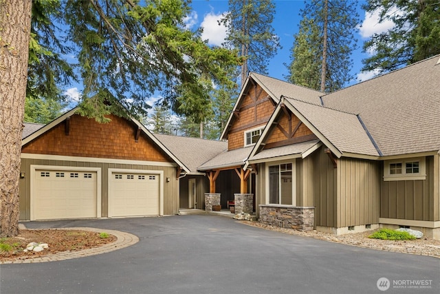2101 Coal Mine Way, Cle Elum, WA 98922 - craftsman house with an attached garage, roof with shingles, and asphalt driveway