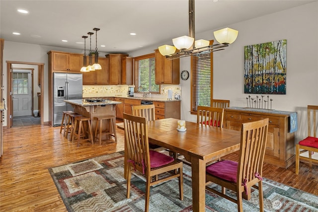 2101 Coal Mine Way, Cle Elum, WA 98922 - dining space featuring light wood finished floors, a chandelier, recessed lighting, and baseboards