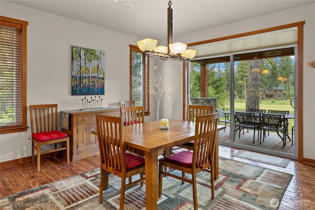 2101 Coal Mine Way, Cle Elum, WA 98922 - dining space with plenty of natural light, a chandelier, wood finished floors, and baseboards