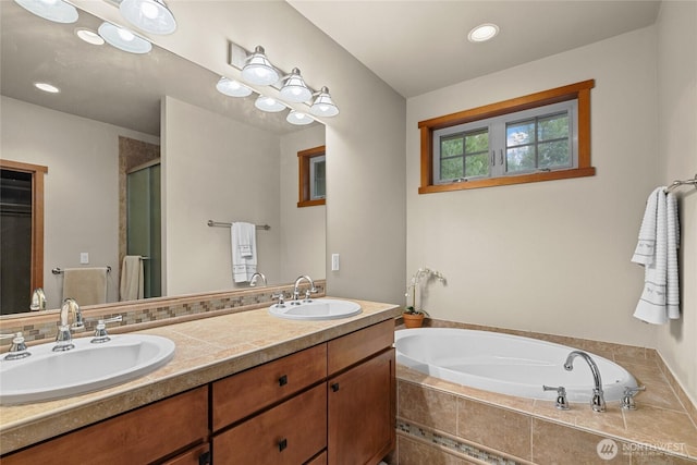 2101 Coal Mine Way, Cle Elum, WA 98922 - full bathroom featuring a garden tub, double vanity, a shower stall, and recessed lighting