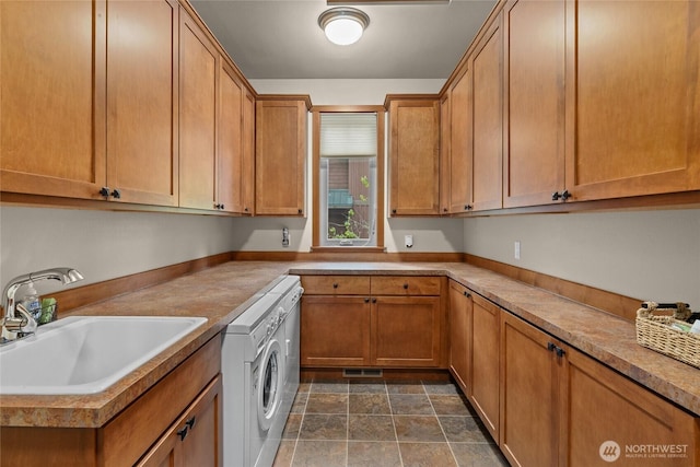 2101 Coal Mine Way, Cle Elum, WA 98922 - laundry room with cabinet space, washer / dryer, and stone finish floors