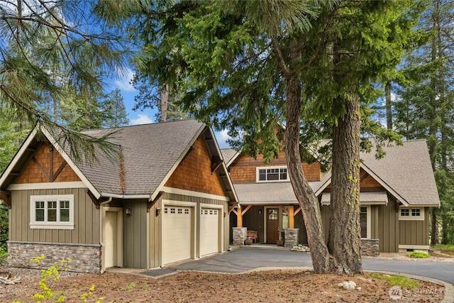 2101 Coal Mine Way, Cle Elum, WA 98922 - craftsman inspired home with a garage, asphalt driveway, stone siding, and board and batten siding