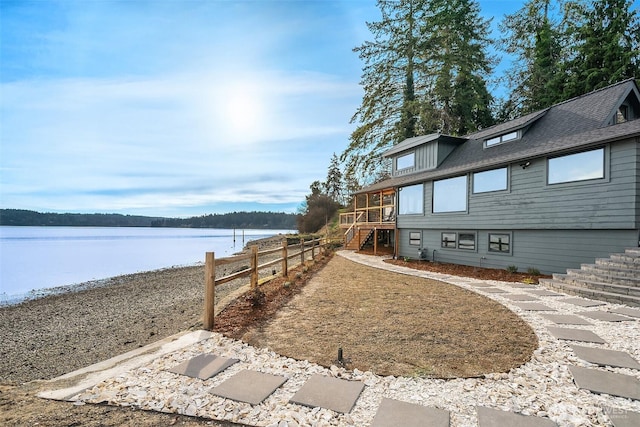 8811 SW Quartermaster Dr, Vashon, WA 98070 - view of yard with stairway and a deck with water view