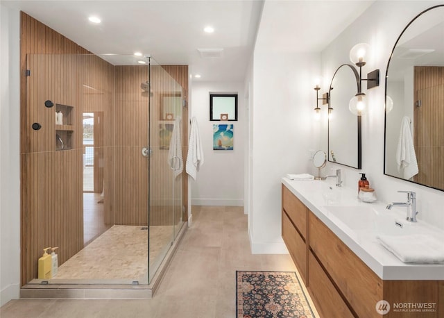 8811 SW Quartermaster Dr, Vashon, WA 98070 - full bathroom featuring double vanity, a stall shower, baseboards, and recessed lighting