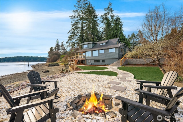 8811 SW Quartermaster Dr, Vashon, WA 98070 - view of patio / terrace with a fire pit, stairway, and a deck with water view