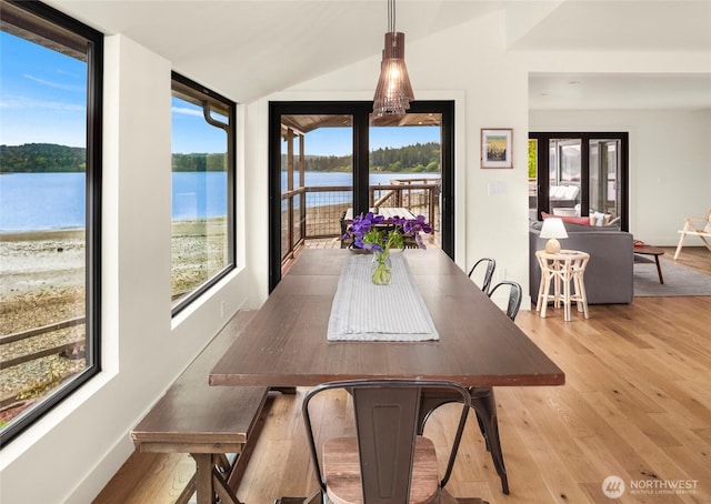 8811 SW Quartermaster Dr, Vashon, WA 98070 - dining room with plenty of natural light, light wood-style flooring, and lofted ceiling