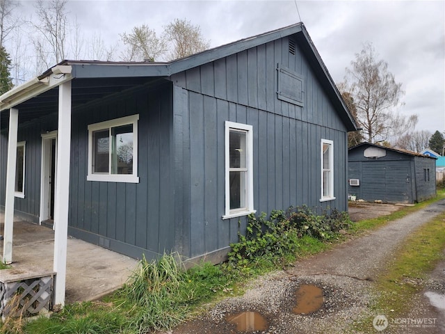 211 E Cherry St, Centralia, WA 98531 - view of side of home featuring board and batten siding