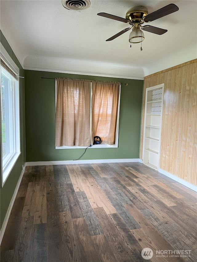 211 E Cherry St, Centralia, WA 98531 - unfurnished room with wood finished floors, a ceiling fan, and baseboards