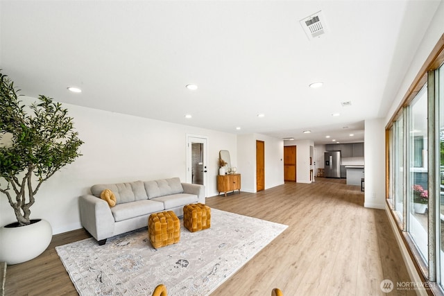 2228 Cinkovich St, Enumclaw, WA 98022 - living area featuring light wood-style floors and recessed lighting