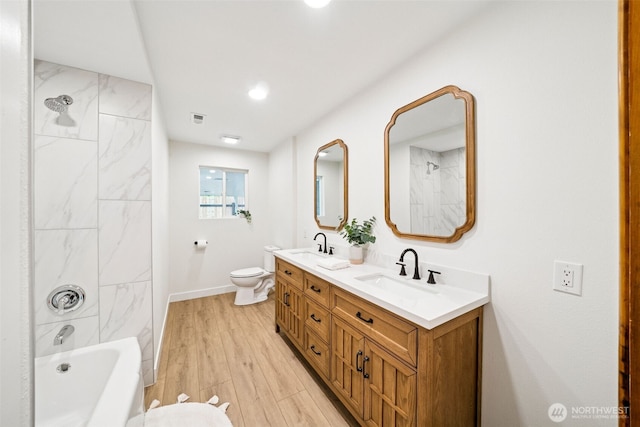 2228 Cinkovich St, Enumclaw, WA 98022 - bathroom with double vanity, wood finished floors, and tub / shower combination