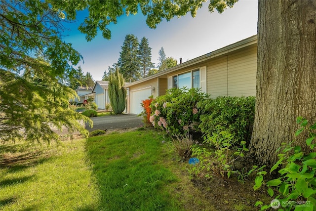 8459 Catalina Ct, Blaine, WA 98230 - view of grassy yard featuring driveway and a garage