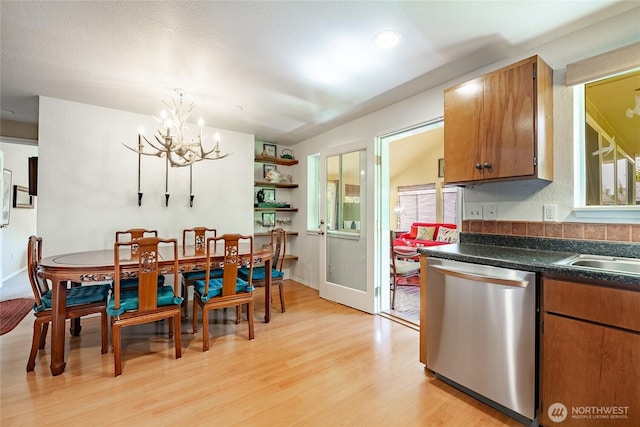 8459 Catalina Ct, Blaine, WA 98230 - dining space with a chandelier, light wood finished floors, healthy amount of natural light, and baseboards