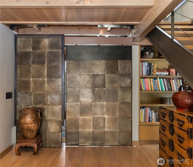 2466 Westlake Ave N Unit 5, Seattle, WA 98109 - sitting room with wood finished floors, wood ceiling with exposed beams, and stairs