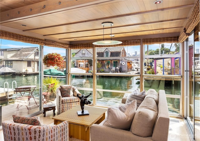 2466 Westlake Ave N Unit 5, Seattle, WA 98109 - sunroom with healthy amount of natural light, a water view, and beamed ceiling