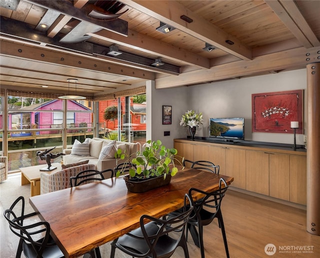 2466 Westlake Ave N Unit 5, Seattle, WA 98109 - dining area with plenty of natural light, light wood-style floors, and wood ceiling with exposed beams