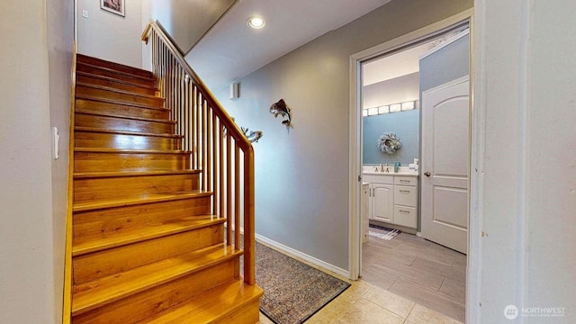 14028 Evergreen Way, Stanwood, WA 98292 - stairway featuring baseboards, tile patterned flooring, and recessed lighting