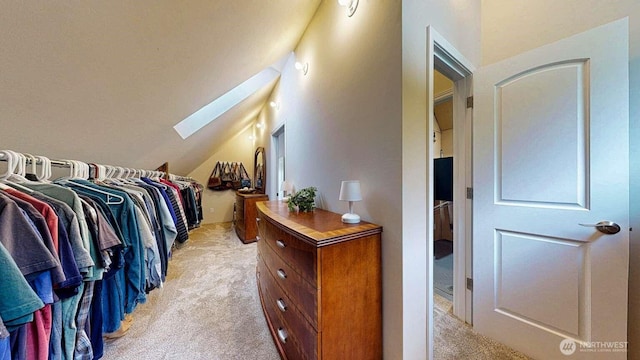 14028 Evergreen Way, Stanwood, WA 98292 - walk in closet featuring light colored carpet, a skylight, and vaulted ceiling