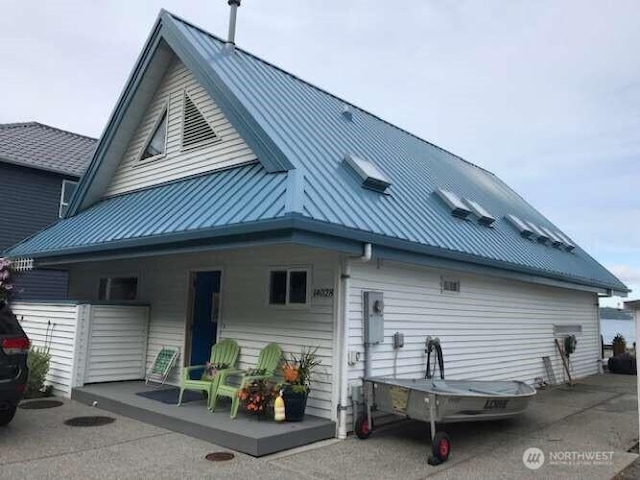 14028 Evergreen Way, Stanwood, WA 98292 - rear view of property featuring metal roof and a standing seam roof