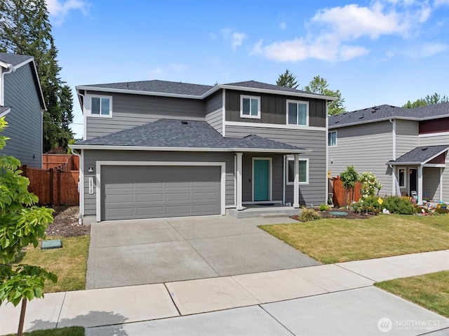 15013 Iverson Loop SE, Yelm, WA 98597 - view of front of house featuring concrete driveway, a garage, and board and batten siding