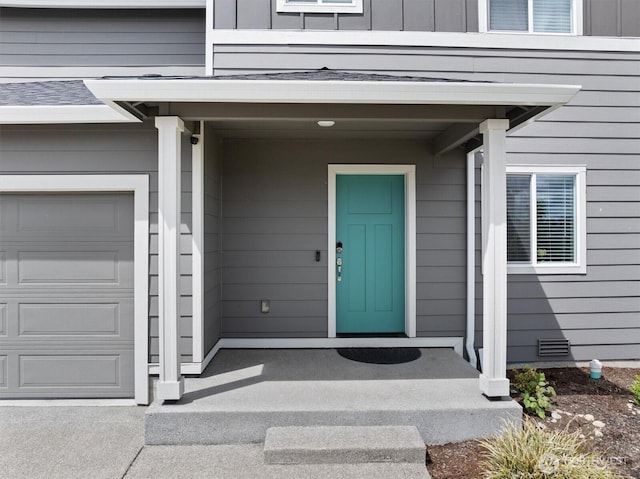 15013 Iverson Loop SE, Yelm, WA 98597 - view of exterior entry with a garage