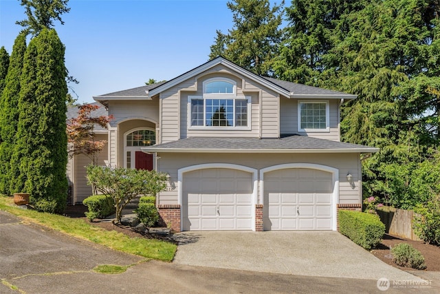 2024 N 145th St, Shoreline, WA 98133 - traditional-style home with an attached garage, concrete driveway, roof with shingles, and brick siding