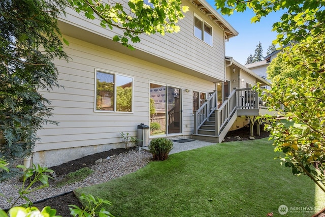 2024 N 145th St, Shoreline, WA 98133 - rear view of house featuring a lawn, stairs, and a deck