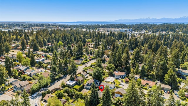2024 N 145th St, Shoreline, WA 98133 - aerial view of property's location featuring mountains, a heavily wooded area, and nearby suburban area