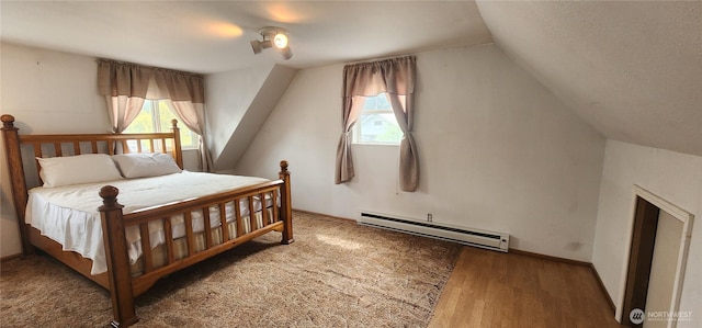 405 E Park St, Dayton, WA 99328 - bedroom with a baseboard radiator, lofted ceiling, and wood finished floors