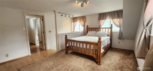 405 E Park St, Dayton, WA 99328 - bedroom with wood finished floors, track lighting, and baseboards