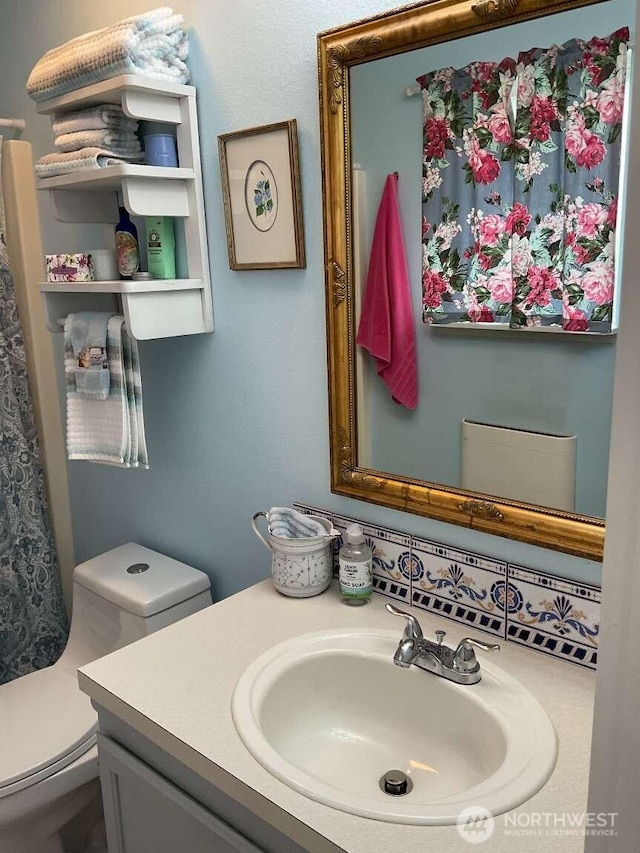 1403 Thomas St, Port Townsend, WA 98368 - bathroom featuring vanity, toilet, and a shower with shower curtain