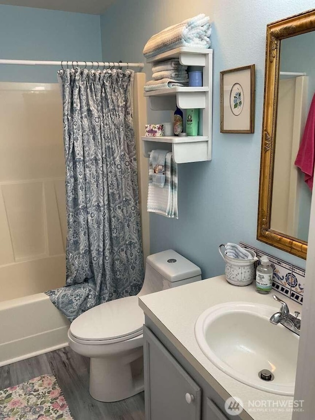 1403 Thomas St, Port Townsend, WA 98368 - full bathroom with vanity, toilet, shower / bath combo, and wood finished floors