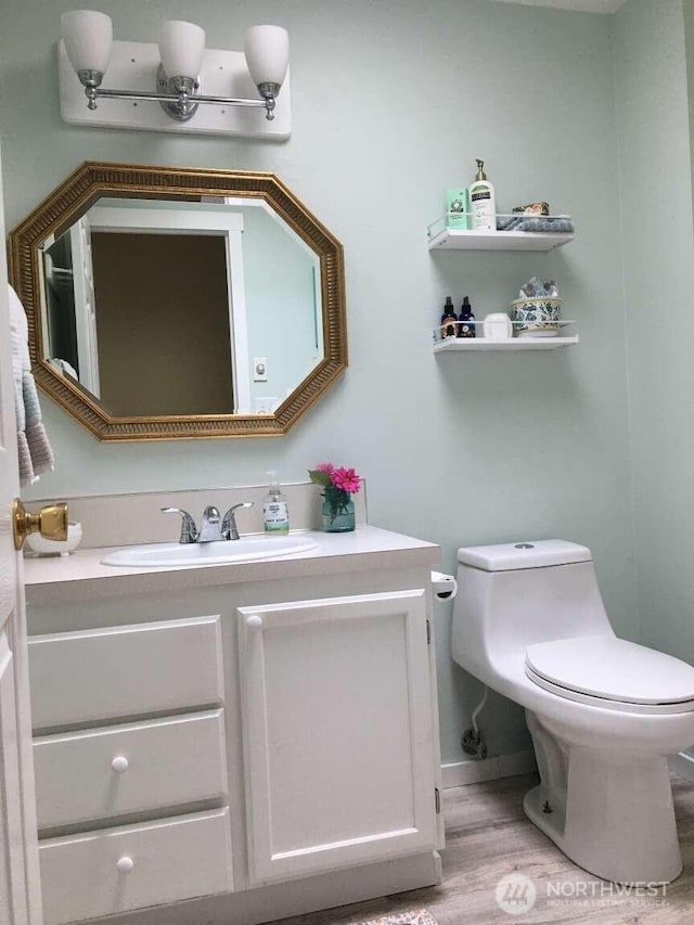 1403 Thomas St, Port Townsend, WA 98368 - half bath with vanity, toilet, and wood finished floors