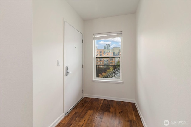 2440 Western Ave Unit 807, Seattle, WA 98121 - unfurnished room featuring dark wood-style floors and baseboards