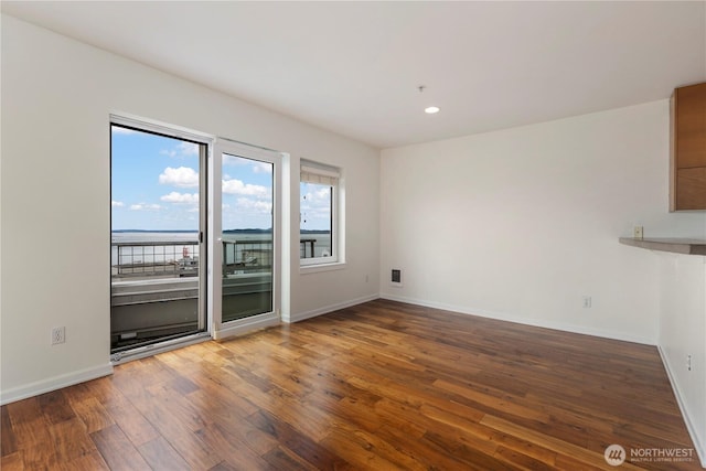 2440 Western Ave Unit 807, Seattle, WA 98121 - unfurnished living room with wood finished floors and recessed lighting