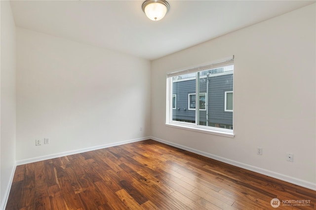 2440 Western Ave Unit 807, Seattle, WA 98121 - spare room with baseboards and hardwood / wood-style floors