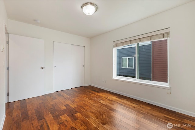 2440 Western Ave Unit 807, Seattle, WA 98121 - unfurnished bedroom featuring wood finished floors and a closet
