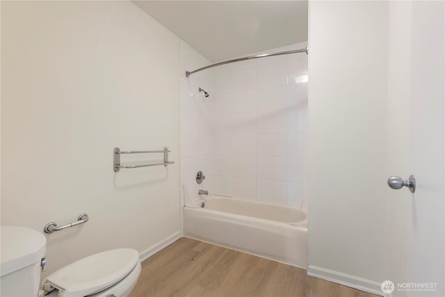 2440 Western Ave Unit 807, Seattle, WA 98121 - bathroom with wood finished floors and washtub / shower combination