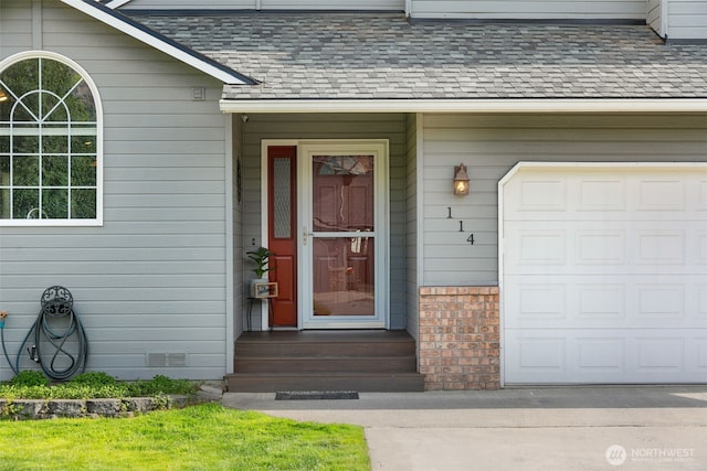 114 Creekside Pl, Cashmere, WA 98815 - property entrance featuring roof with shingles, an attached garage, and brick siding